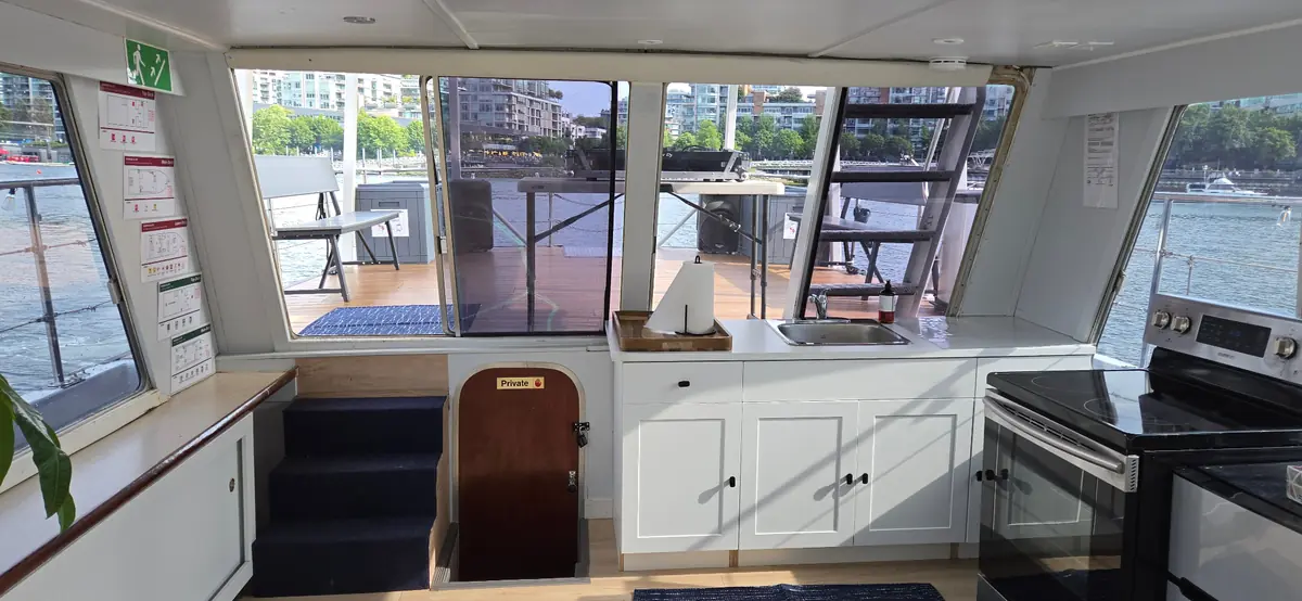 Joy's galley and interior with marina views